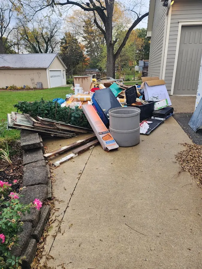Dumpster being loaded with debris for Commercial Dumpster Rental in Cheektowaga